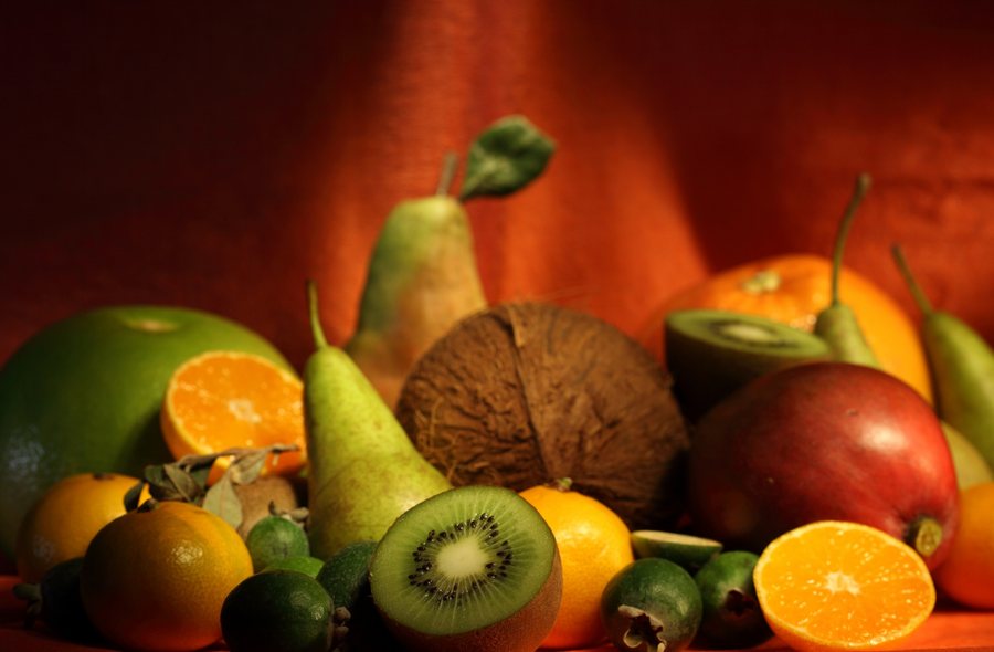 Colourful whole fruit including pears, oranges, kiwi and apples
